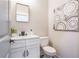 Elegant powder room featuring modern black hardware, decorative art, and attractive fixtures at 1253 Lucile Sw Ave, Atlanta, GA 30310