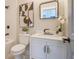 Charming bathroom with decorative mirror, modern art, and stylish gold faucet and hardware at 1253 Lucile Sw Ave, Atlanta, GA 30310