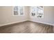 Cozy bedroom with hardwood floors, bright windows, and neutral paint, perfect for relaxation at 1253 Lucile Sw Ave, Atlanta, GA 30310