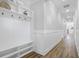 Bright hallway featuring sleek wood floors and a built-in storage bench at 1253 Lucile Sw Ave, Atlanta, GA 30310