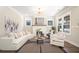 Bright and airy living room with modern decor, fireplace, and large windows at 1253 Lucile Sw Ave, Atlanta, GA 30310