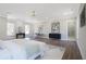 The bright main bedroom includes a ceiling fan, natural light, an ensuite bathroom, and modern décor at 1253 Lucile Sw Ave, Atlanta, GA 30310