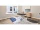 Bright home office with modern desk, stylish decor, and large windows showcasing the backyard at 1253 Lucile Sw Ave, Atlanta, GA 30310