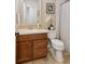 Bathroom features a vanity, white toilet, and shower with a curtain at 2277 Lazy Days Rd, Dacula, GA 30019