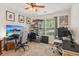 Bedroom has two workstations, window with covering, carpet and display shelves at 2277 Lazy Days Rd, Dacula, GA 30019