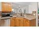 Open-concept kitchen with granite countertops and stainless steel dishwasher at 2277 Lazy Days Rd, Dacula, GA 30019