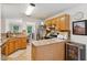 Open kitchen featuring granite countertops, stainless steel appliances, and tile backsplash at 2277 Lazy Days Rd, Dacula, GA 30019