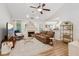 Cozy living room with a fireplace, comfortable seating, and plenty of natural light at 2277 Lazy Days Rd, Dacula, GA 30019