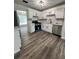 Bright kitchen featuring white cabinets, granite countertops, and stainless steel appliances at 2720 Thornbury Way, Atlanta, GA 30349