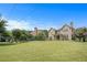 Expansive backyard featuring lush lawn and a charming fire pit area, great for entertaining guests at 585 Lawton Bridge Sw Rd, Smyrna, GA 30082