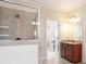 Bathroom featuring a glass enclosed shower, tile flooring, and wooden vanity at 585 Lawton Bridge Sw Rd, Smyrna, GA 30082