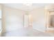 Neutral bedroom featuring plush carpet, a ceiling fan, and a brightly painted doorway at 585 Lawton Bridge Sw Rd, Smyrna, GA 30082