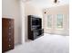 Bright bedroom with large windows, neutral carpet, and built in entertainment center at 585 Lawton Bridge Sw Rd, Smyrna, GA 30082
