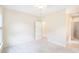 Spacious bedroom with neutral carpeting, ample natural light, and a walk-in closet at 585 Lawton Bridge Sw Rd, Smyrna, GA 30082