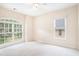 Bright bedroom featuring large windows offering plenty of natural light and neutral carpet at 585 Lawton Bridge Sw Rd, Smyrna, GA 30082