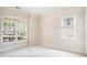 Bedroom features natural light from two windows and neutral walls and carpeting at 585 Lawton Bridge Sw Rd, Smyrna, GA 30082