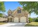 Well-maintained home showcasing the side view, two car garage, and landscaping at 585 Lawton Bridge Sw Rd, Smyrna, GA 30082
