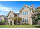 Back of a home featuring a covered porch and a neatly manicured lawn at 585 Lawton Bridge Sw Rd, Smyrna, GA 30082