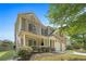 Charming front exterior view with brick accents, well-manicured landscaping, and a two-car garage at 585 Lawton Bridge Sw Rd, Smyrna, GA 30082