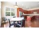 Kitchen and breakfast nook with wood floors, stainless appliances, and natural light at 585 Lawton Bridge Sw Rd, Smyrna, GA 30082