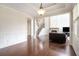 Elegant living room with hardwood floors, stone fireplace, and wainscoting at 585 Lawton Bridge Sw Rd, Smyrna, GA 30082