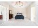 Spacious main bedroom with a ceiling fan and an adjoining en-suite bathroom at 585 Lawton Bridge Sw Rd, Smyrna, GA 30082