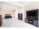 Spacious main bedroom boasts tray ceilings, neutral carpet and walls, and a ceiling fan at 585 Lawton Bridge Sw Rd, Smyrna, GA 30082