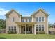 Rear exterior featuring a covered patio, and a large well manicured lawn at 585 Lawton Bridge Sw Rd, Smyrna, GA 30082