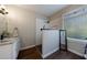 Elegant bathroom featuring a glass shower, granite countertop, and hardwood floors at 6455 Ivey Meadow Ln, Cumming, GA 30040
