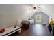 Bright bedroom with a low ceiling, built-in drawers, and a window view at 6455 Ivey Meadow Ln, Cumming, GA 30040