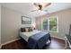 Bedroom with a large window and a full sized bed with blue decor at 6455 Ivey Meadow Ln, Cumming, GA 30040