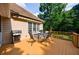 Spacious deck with grill, table, and chairs, perfect for entertaining and enjoying the outdoor view at 6455 Ivey Meadow Ln, Cumming, GA 30040