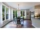 Bright breakfast nook with large windows providing natural light and views of the surrounding greenery at 6455 Ivey Meadow Ln, Cumming, GA 30040