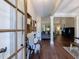 Welcoming entryway with hardwood floors, stylish decor, and a view into the spacious living room at 6455 Ivey Meadow Ln, Cumming, GA 30040