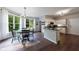 Open-concept kitchen with stainless steel appliances, granite countertops, and an island for casual dining at 6455 Ivey Meadow Ln, Cumming, GA 30040