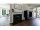 Elegant fireplace with decorative mantle and adjacent cabinet, offering a cozy and stylish space at 6455 Ivey Meadow Ln, Cumming, GA 30040
