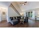 Inviting living room featuring vaulted ceilings, a comfortable sectional sofa, and hardwood floors at 6455 Ivey Meadow Ln, Cumming, GA 30040