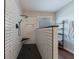 Modern shower with white subway tile, black fixtures, and a black herringbone tile floor at 6455 Ivey Meadow Ln, Cumming, GA 30040
