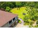Spacious backyard view from a columned deck featuring a circular stone walkway to the front at 6919 Mount Zion Rd, Waco, GA 30182