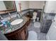 Charming bathroom featuring granite countertop, dark wood vanity, and tiled walls at 6919 Mount Zion Rd, Waco, GA 30182