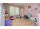 Bright bedroom decorated with pink wall and canopy tent and filled with toys at 6919 Mount Zion Rd, Waco, GA 30182