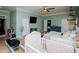 Spacious bedroom with soft green walls, laminate floors, and ample natural light at 6919 Mount Zion Rd, Waco, GA 30182