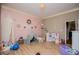 Spacious bedroom featuring pink wall, canopy tent and multiple toys at 6919 Mount Zion Rd, Waco, GA 30182