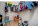 Walk-in closet with clothes and storage at 6919 Mount Zion Rd, Waco, GA 30182