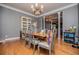 Elegant dining room with hardwood floors and a classic chandelier at 6919 Mount Zion Rd, Waco, GA 30182