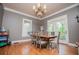 Spacious dining room with hardwood floors and elegant chandelier at 6919 Mount Zion Rd, Waco, GA 30182