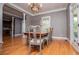 Elegant dining room with hardwood floors and a classic chandelier at 6919 Mount Zion Rd, Waco, GA 30182
