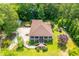 Charming home boasts a large, landscaped yard with a playset, fountain, and inviting front porch at 6919 Mount Zion Rd, Waco, GA 30182