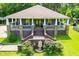 Charming home featuring a welcoming front porch, landscaped garden, and inviting entrance at 6919 Mount Zion Rd, Waco, GA 30182