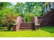 Inviting brick stairs leading to a home, enhanced by manicured landscaping and charming outdoor lighting at 6919 Mount Zion Rd, Waco, GA 30182